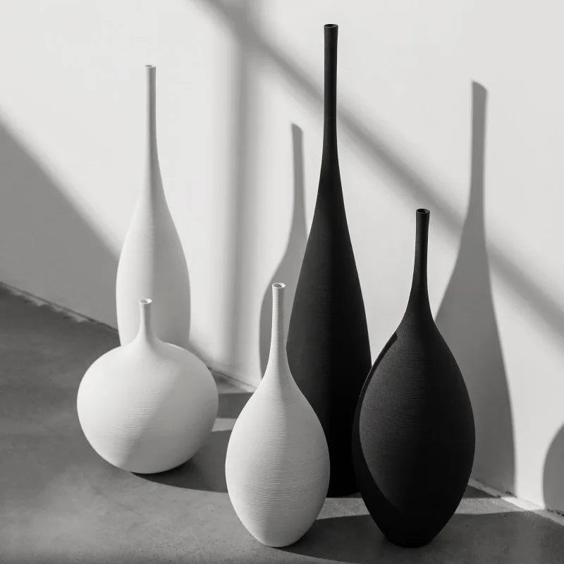 Minimalist capiron zen ceramic vases in sleek white and matte black with elongated necks for nordic home decor