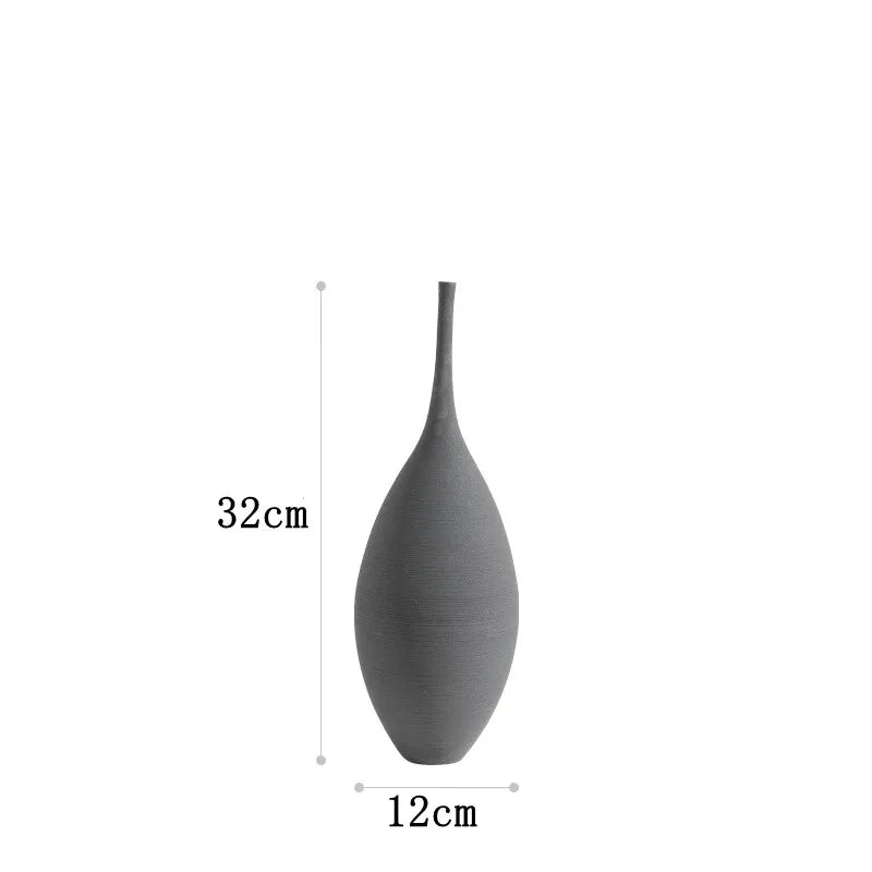 A sleek matte gray ceramic zen vase with a slender neck and rounded body for home decoration and flowerpot use