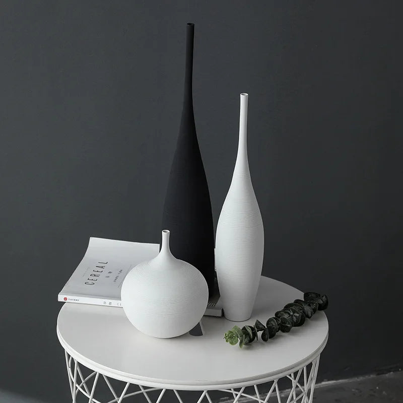 Minimalist capiron zen ceramic vases in sleek black and white with smooth modern contours for home decoration