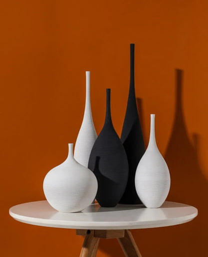 Capiron zen ceramic vases in sleek white and matte black with subtle texture for nordic interior decoration