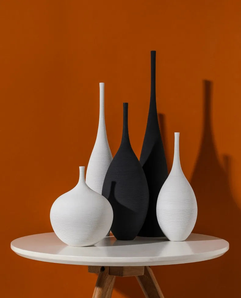 Capiron zen ceramic vases in sleek white and matte black with subtle texture for nordic interior decoration