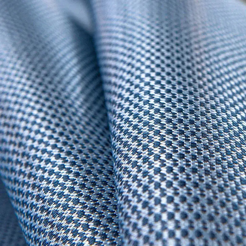 Blue and white herringbone woven fabric with textured pattern on decorbites carbon light cooling mat and pillowcase set