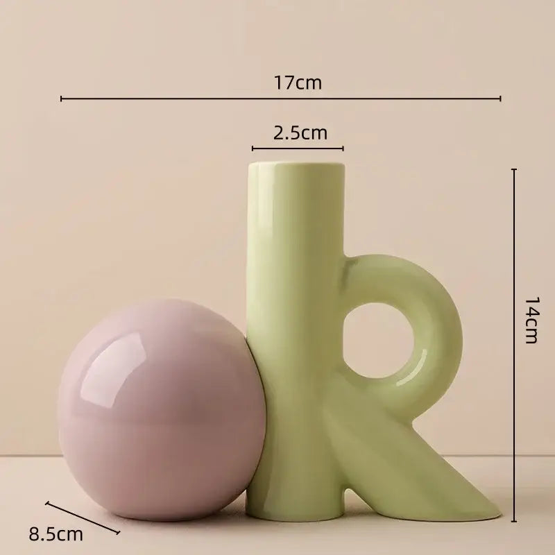 A sleek light green abstract ceramic vase with a circular handle for decorbites cartoon abstract living room decor