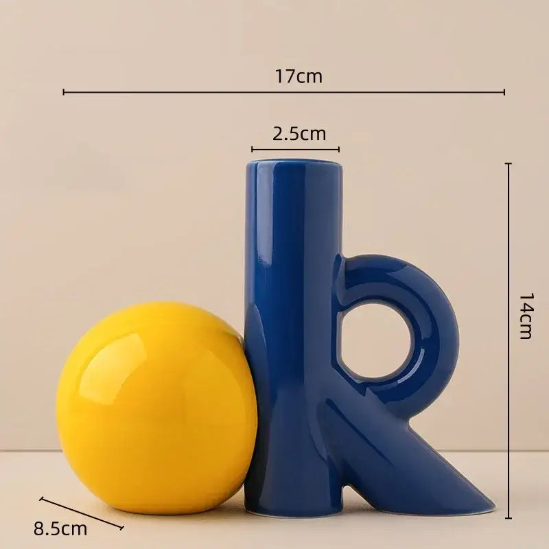 Blue ceramic letter k bookend with a glossy yellow sphere featuring decorbites cartoon abstract ceramic vase design