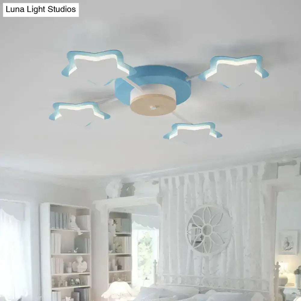 Blue and white cloud-shaped acrylic ceiling light fixture with central wooden disc for cartoon acrylic pink blue decor