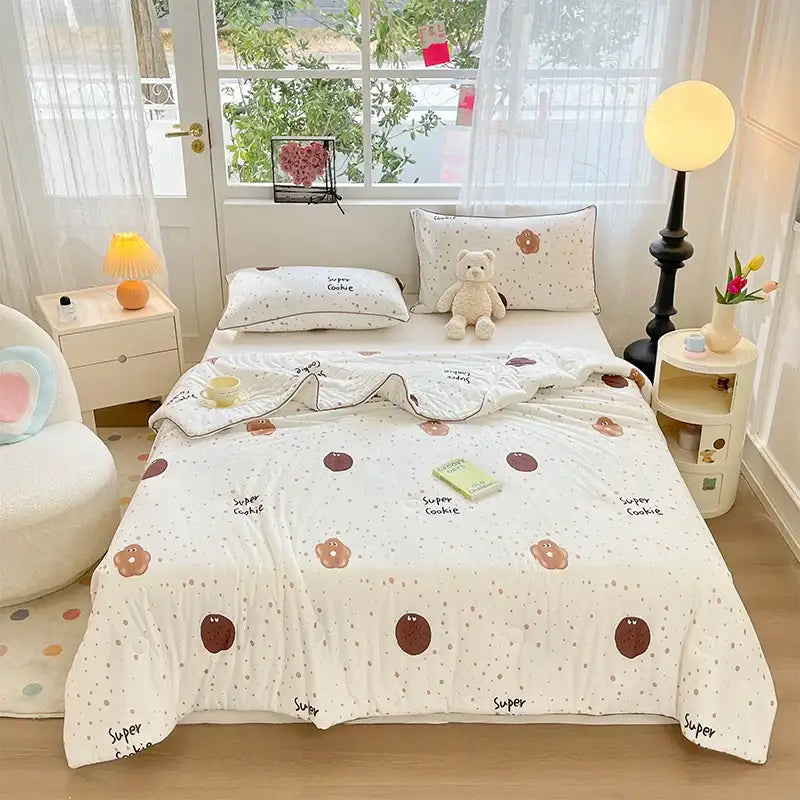White quilted kids summer quilt with playful super cookie pattern in brown and beige soft knitted fabric decorbites kids