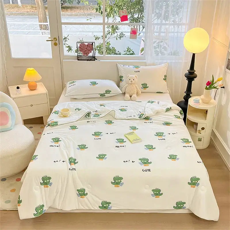 White cotton kids summer quilt with green cactus and cute print from decorbites kids summer collection