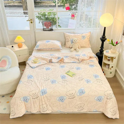 Cream-colored kids summer quilt by decorbites featuring a playful light blue and beige cartoon bear pattern
