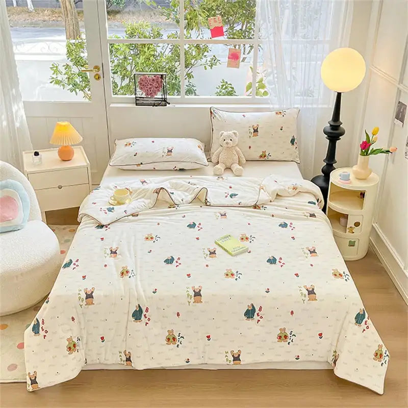 Cream-colored quilted kids summer quilt with soft knitted texture and cartoon bears floral pattern by decorbites kids summer