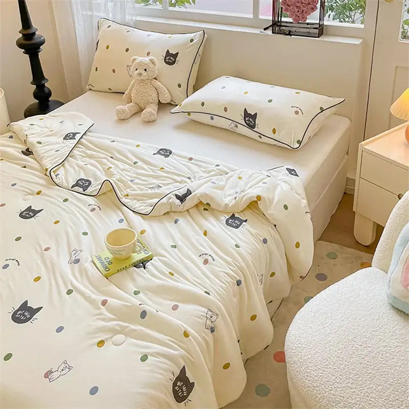 Cream-colored quilted kids summer quilt with black cat and multicolored polka dot patterns by decorbites kids