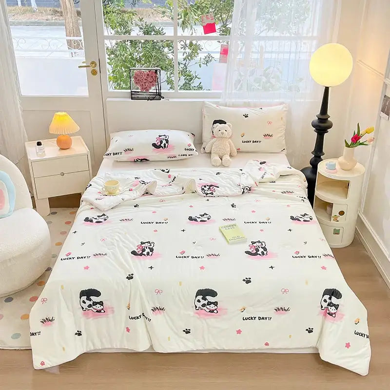 White cream kids summer quilt featuring a soft knitted comforter with cartoon pandas and lucky day design from decorbites kids summer
