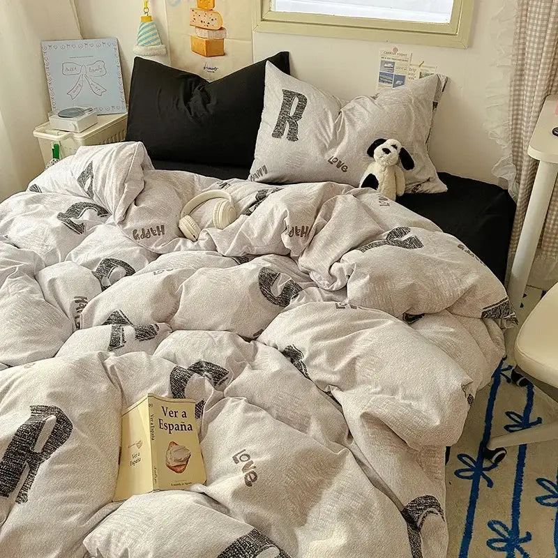 Cozy off-white satin quilt cover set with bold black graphic letters and love print for bedroom bedding