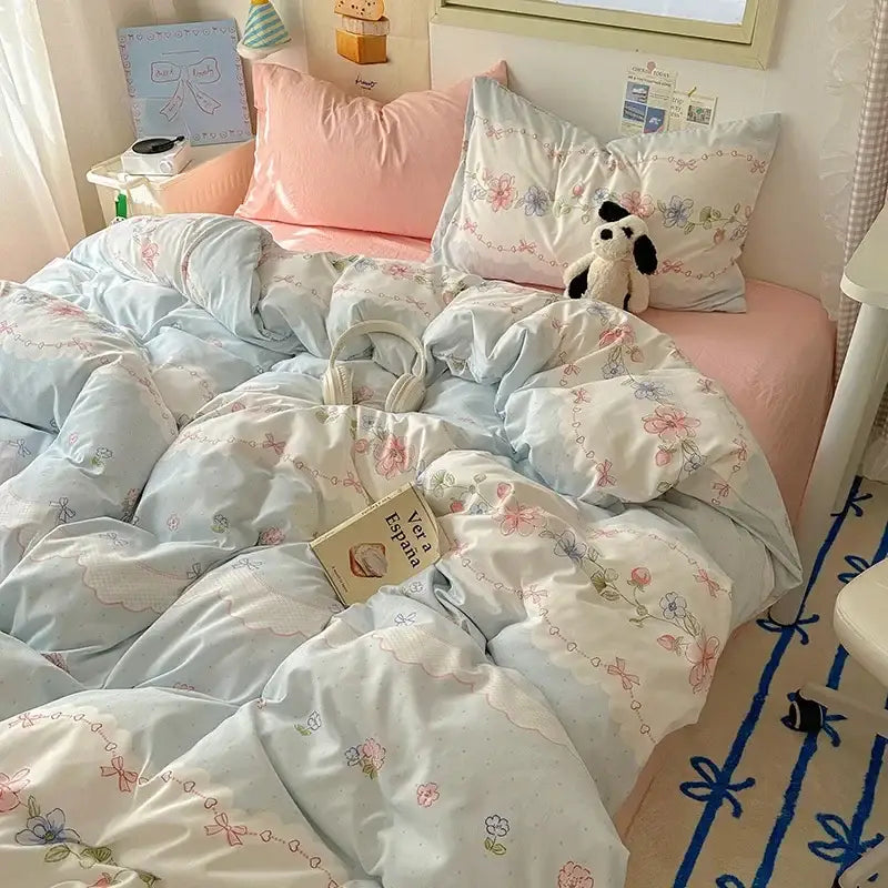 Light blue floral patterned cotton quilt cover set with delicate pink and purple blossoms for bedroom bedding