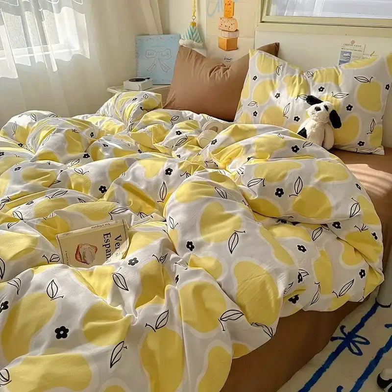Yellow and white lemon-patterned satin quilt cover set with black floral accents for bedroom bedding use