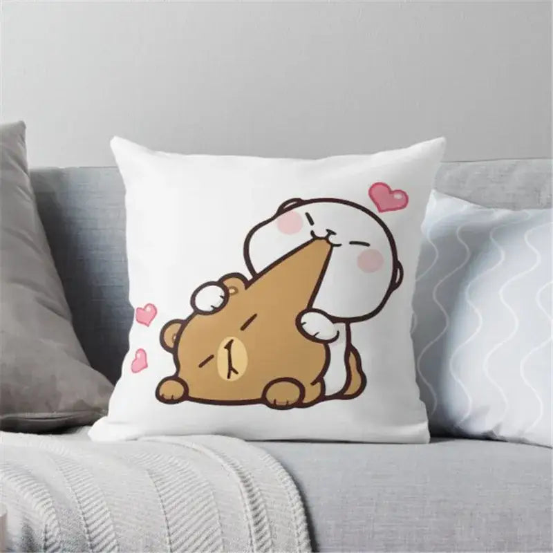 White throw pillow with decorbites cartoon animal printed design featuring two characters and pink hearts animal printed pillowcase