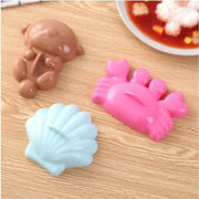 Cartoon animal sushi mold set with three colorful silicone molds in brown bear pink crab and light blue seashell shapes