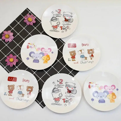 Set of six white ceramic bone snack plates with colorful cartoon bears mice and detective illustrations from decorbites