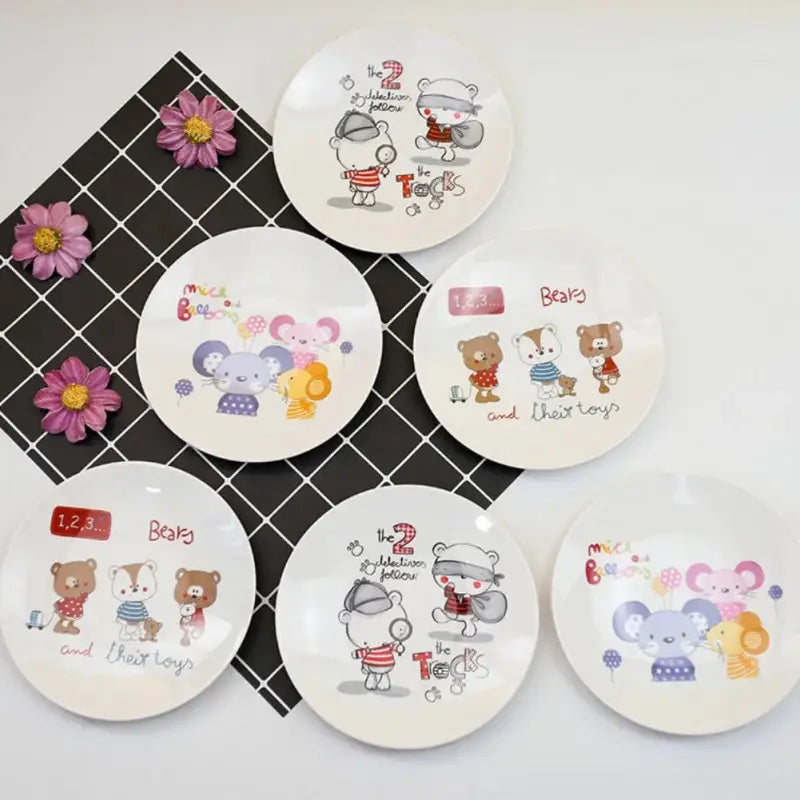 Set of six white ceramic bone snack plates with colorful cartoon bears mice and detective illustrations from decorbites