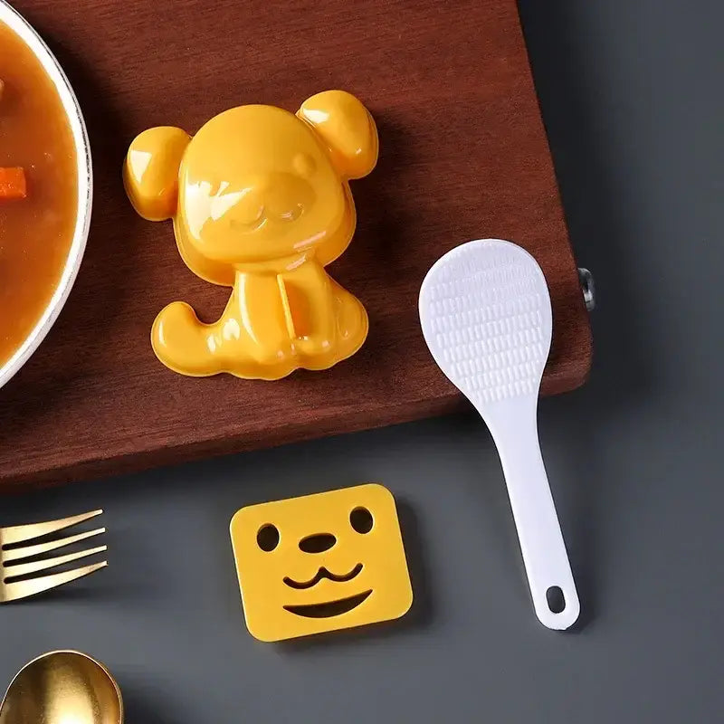 Yellow plastic dog-shaped rice mold from decorbites cartoon animals mold set for cartoon animals sushi and sandwich making