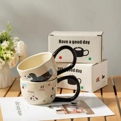 Cream-colored ceramic cartoon big ear cup mug with black handles featuring playful animal designs for kitchen decorbites cartoon big use