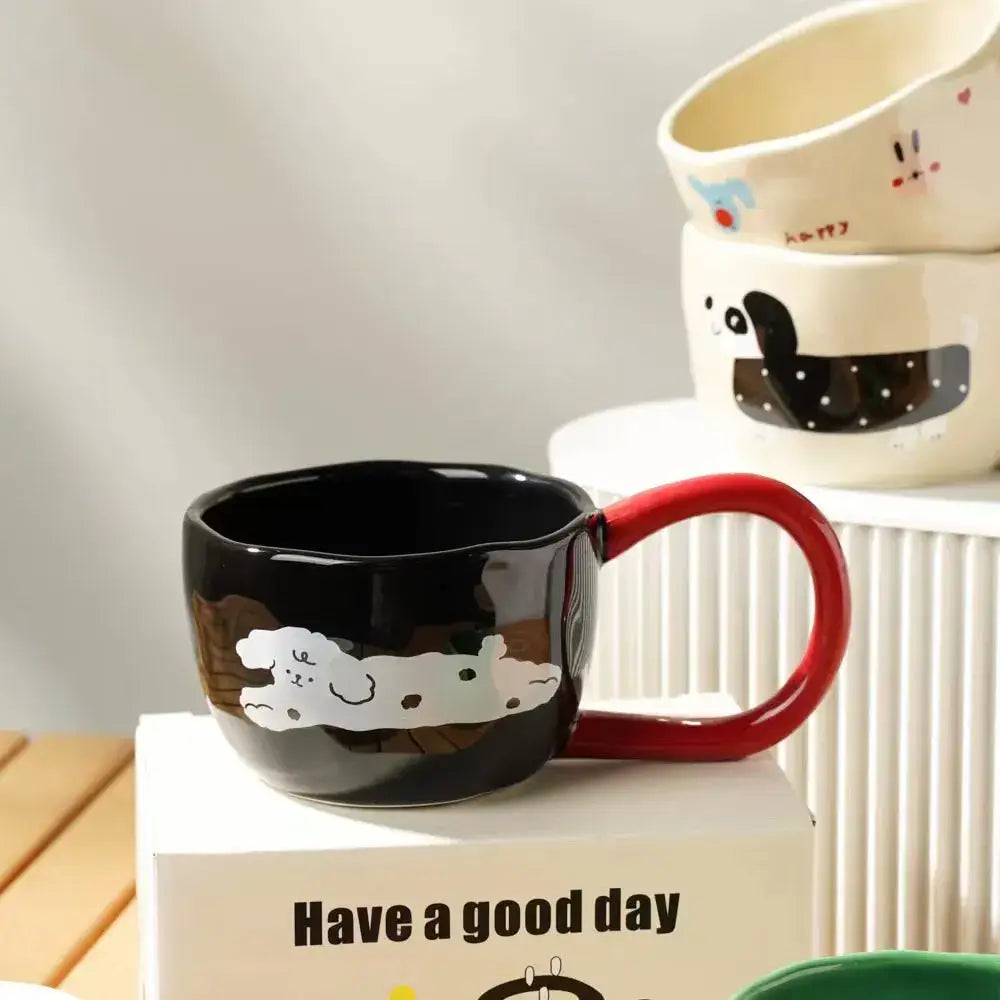 Black ceramic mug with red handle featuring a white cartoon dog design from decorbites cartoon big ear cup series