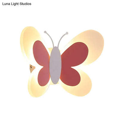 Cute butterfly-shaped led wall light with red and cream wings gray body and silver antennae for kindergarten use