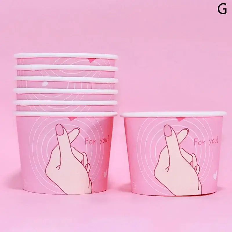 Pink paper cups with white rims featuring a cute hand gesture and for you text from decorbites cartoon paper cups collection