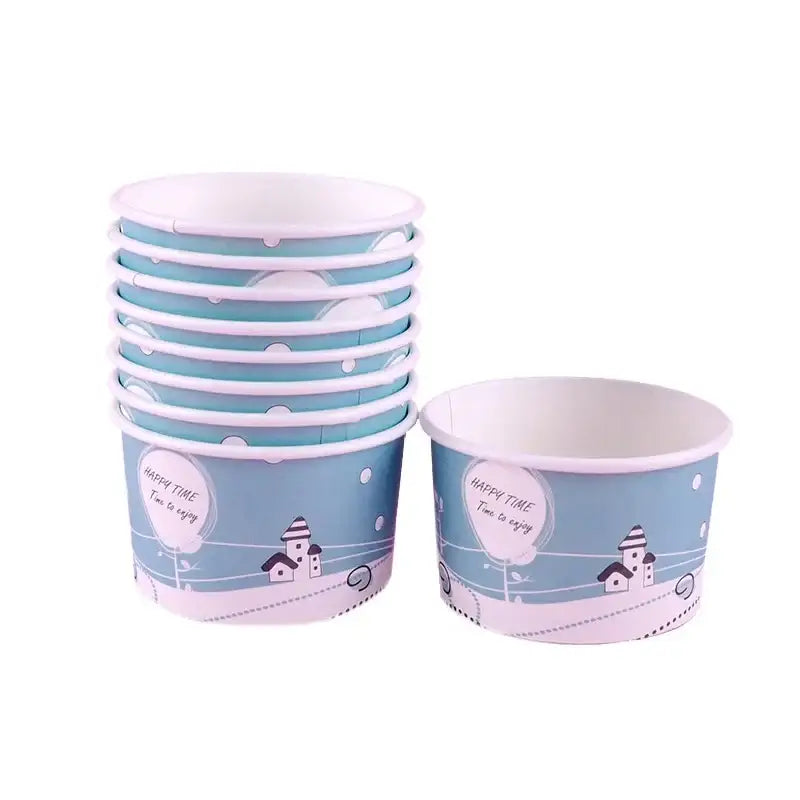 Stack of light blue and white decorbites cartoon paper cups with lids featuring village design and happy time script