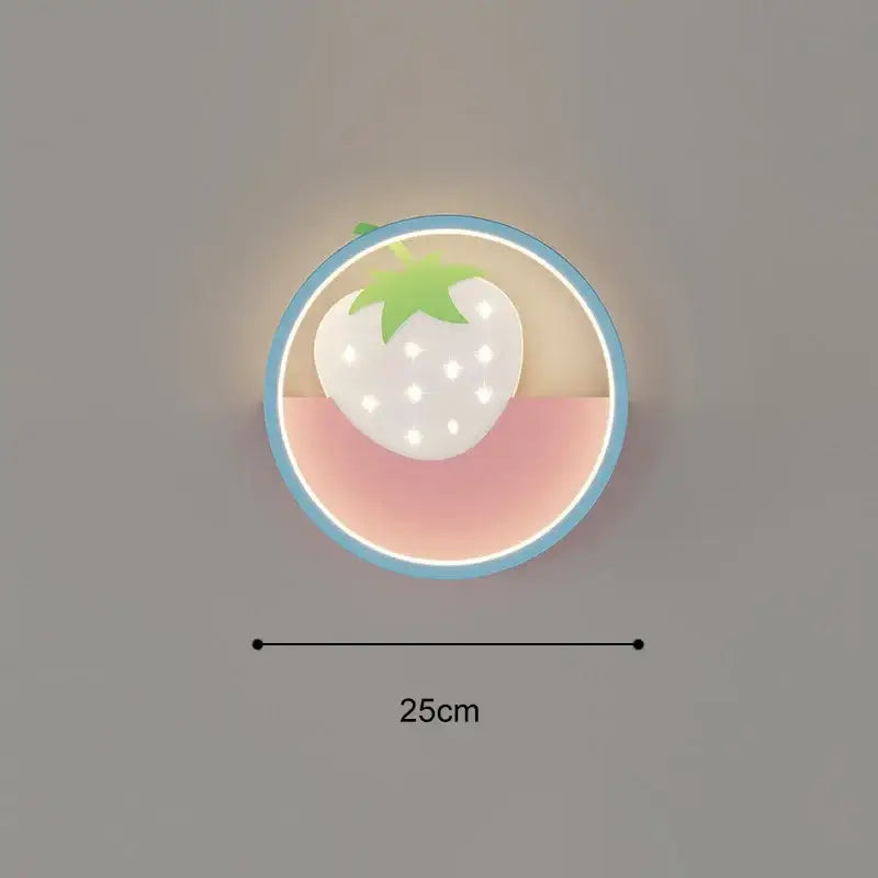 Cartoon wall lamp featuring a circular white strawberry with green top and dot details on a soft pink background