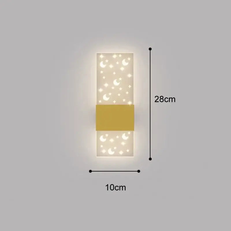 A modern rectangular wall lamp with frosted glass crescent moons and stars and a mustard-yellow band for bedroom use