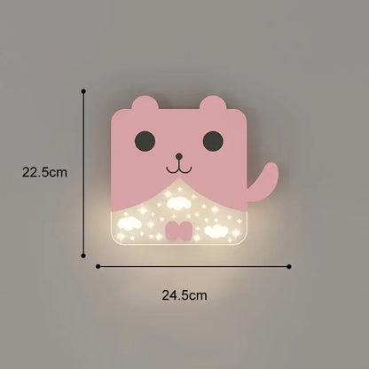 Pink cartoon bear-shaped wall lamp with glowing lower half and cloud star patterns suitable for bedroom use