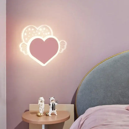 A glowing pink heart-shaped cartoon wall lamp with white outline and starry wings for bedroom led art lighting
