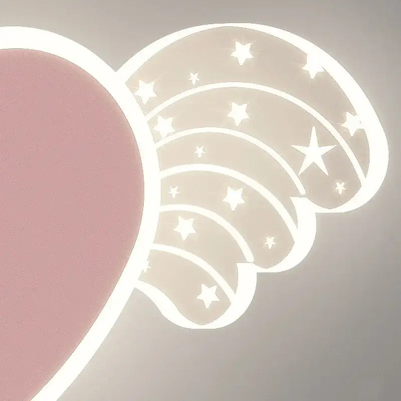 A soft pink and white cartoon wall lamp shaped like angel wings with star cutouts for bedroom decoration