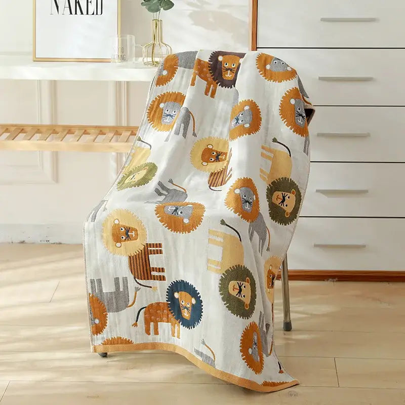 A soft white cotton gauze bath towel with colorful cartoon lions for bedroom and nursery decorbites cotton gauze