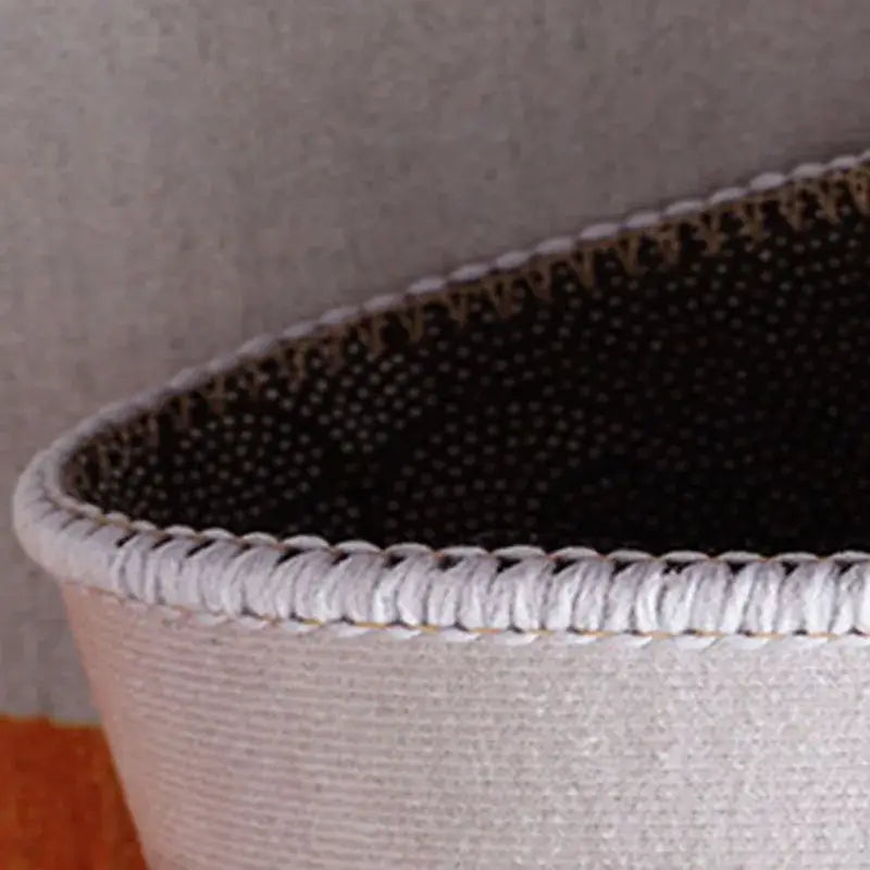 A light gray woven basket with a braided rim and perforated dark interior complements the cartoon cat black and white checkered door mat decorbites block crystal velvet