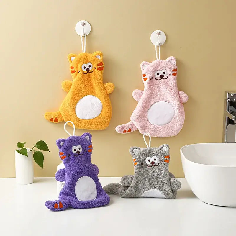 Adorable cartoon cat coral velvet hand towels in gray and pink paired with colorful plush cat-shaped bath sponges for decorbites bathroom decor