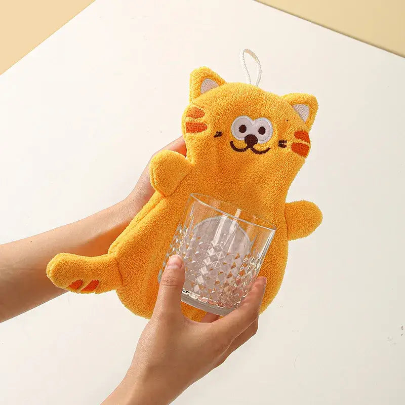 A plush bright orange coral velvet cartoon cat pot holder with embroidered face and hanging loop for decorbites hand towels