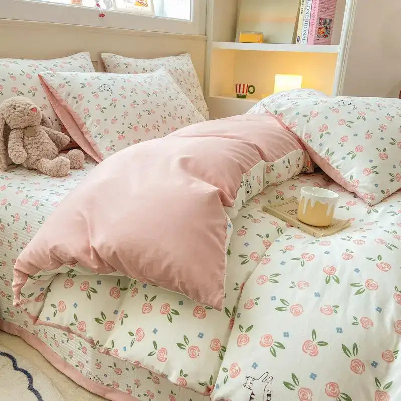 Pink floral cotton duvet cover set with cartoon cat design featuring soft fabric and delicate rose motifs for bedroom use