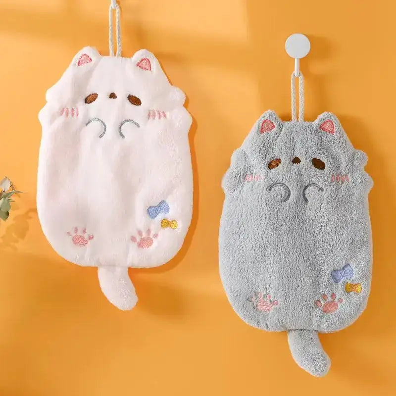 Two plush cartoon cat microfiber hand towels in pink and gray with embroidered details by decorbites