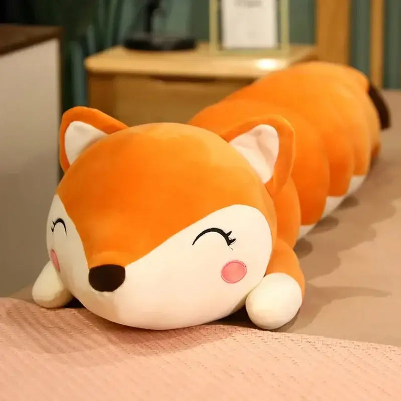 Plush orange and green cartoon caterpillar long body pillow featuring a soft orange fox with white accents and pink cheeks lying on its side