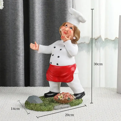 A charming 30cm resin cartoon chef wine rack with white coat red apron tall hat standing on grassy base decorbites cartoon chef