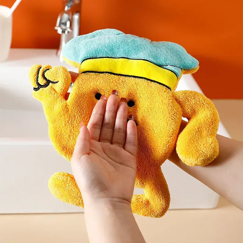 Yellow plush crab shaped microfiber hand towel with teal and yellow hat for kitchen wall hooks use