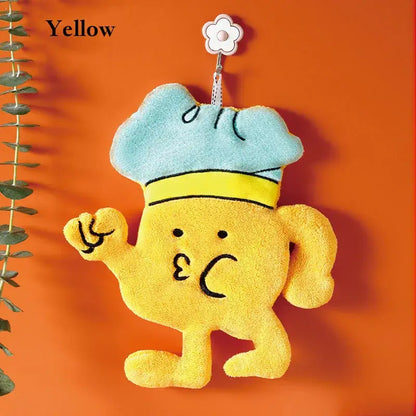 Yellow plush cartoon chef microfiber hand towel with light blue hat hanging from flower-shaped kitchen wall hook