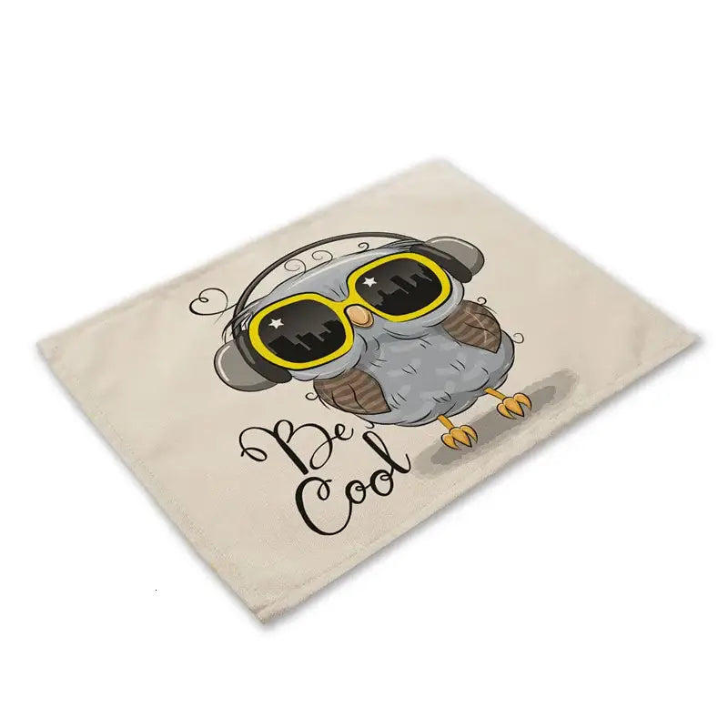 Beige canvas dining table placemat featuring decorbites cute owl animal design with gray owl wearing yellow sunglasses and headphones