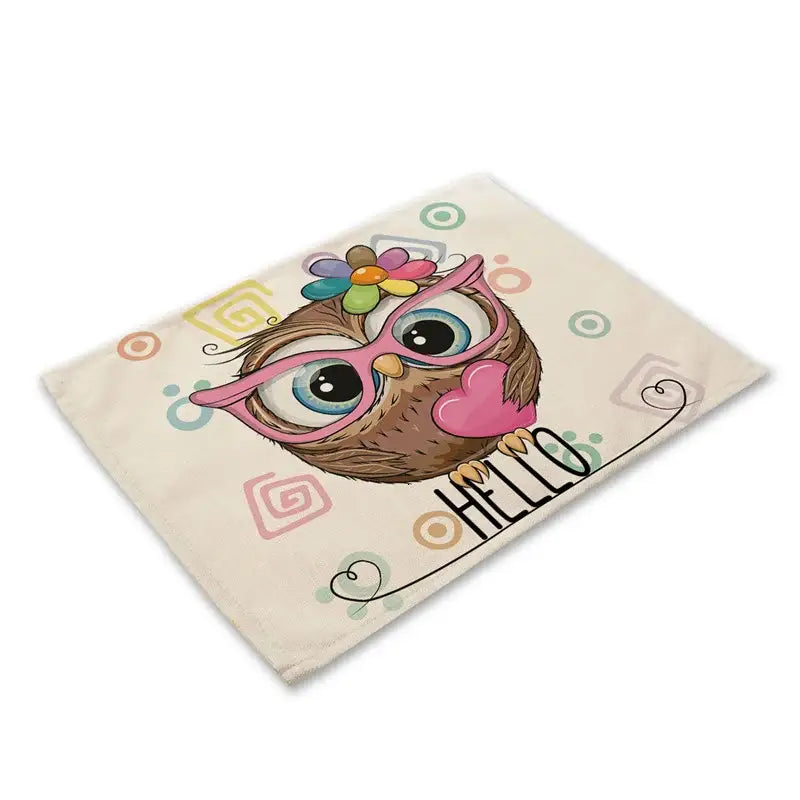 Cream-colored cotton dining table placemat with decorbites cute owl wearing pink glasses and hello script design