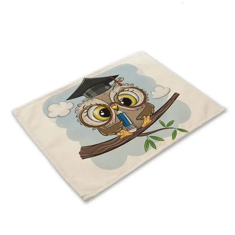 Cream-colored canvas dining table placemat featuring decorbites cute owl animal with graduation cap and pencil design