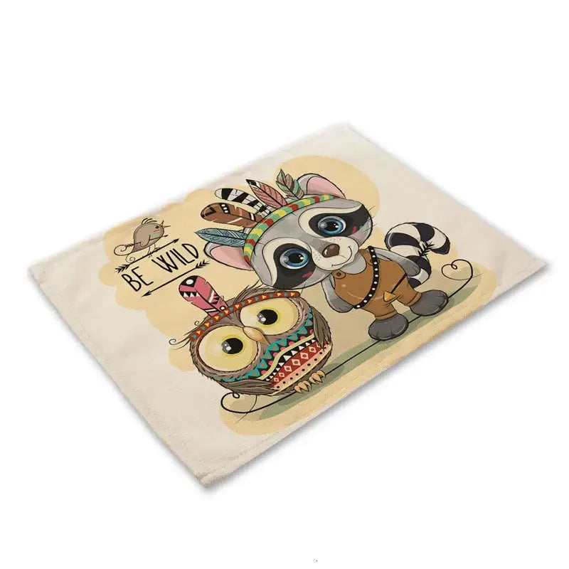 Beige canvas dining table placemat featuring decorbites cute owl and raccoon in tribal attire with be wild phrase