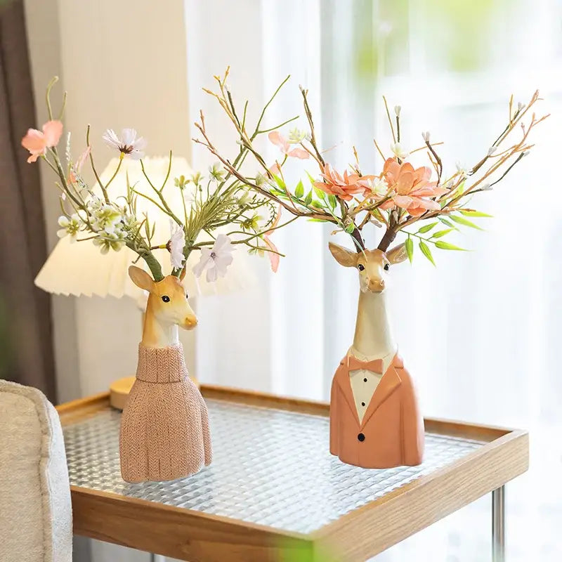 Two ceramic cartoon deer vases in beige and orange resin with knitted sweater and tuxedo for living room decor