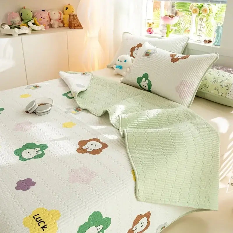 Pastel green and white quilted cotton bed cover set with cartoon dinosaur prints for bedroom use