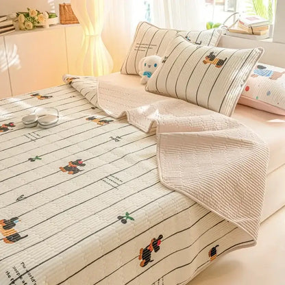 Cream-colored quilted cotton bed cover set with playful cartoon dachshund prints and black vertical stripes